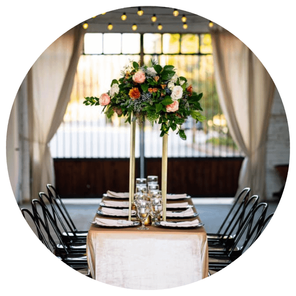 simple table setting with tall floral centerpiece 