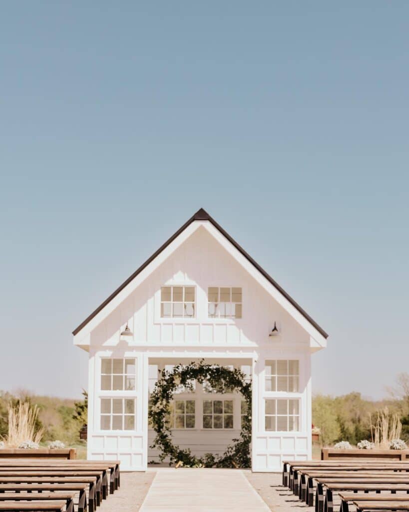 outdoor wedding ceremony with floral arch 
